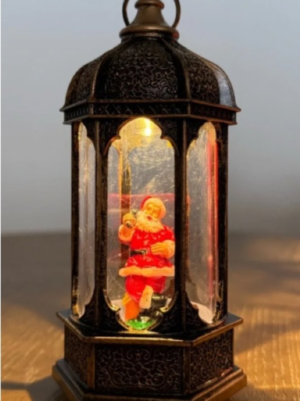 Festive Lantern Decor with Red Santa Accent
